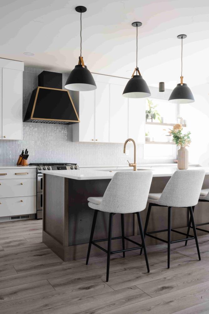 Black appliances can stand out in a white kitchen.
