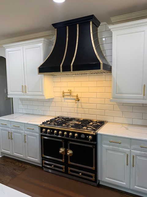 black and brass kitchens