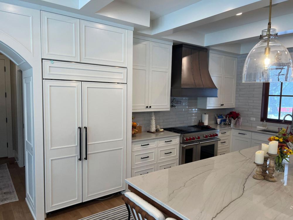 white kitchen with metal hood
