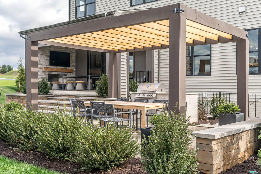 A pergola helps to naturally cool and outdoor kitchen.