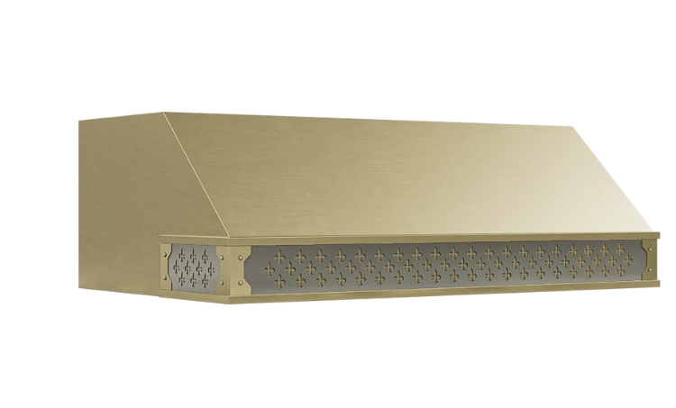 Brushed brass range hood with an angled design and decorative fleur-de-lis metal trim.