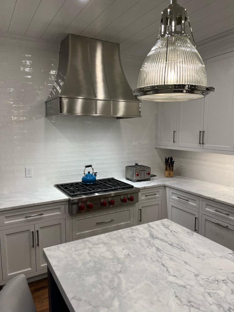 cottage kitchen with modern range hood