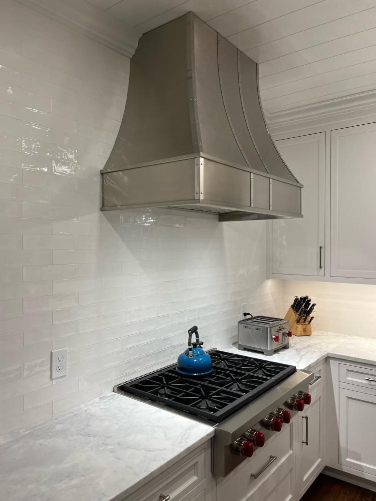 marbled white tile backsplash