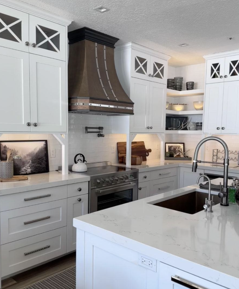 white cabinets with copper hood