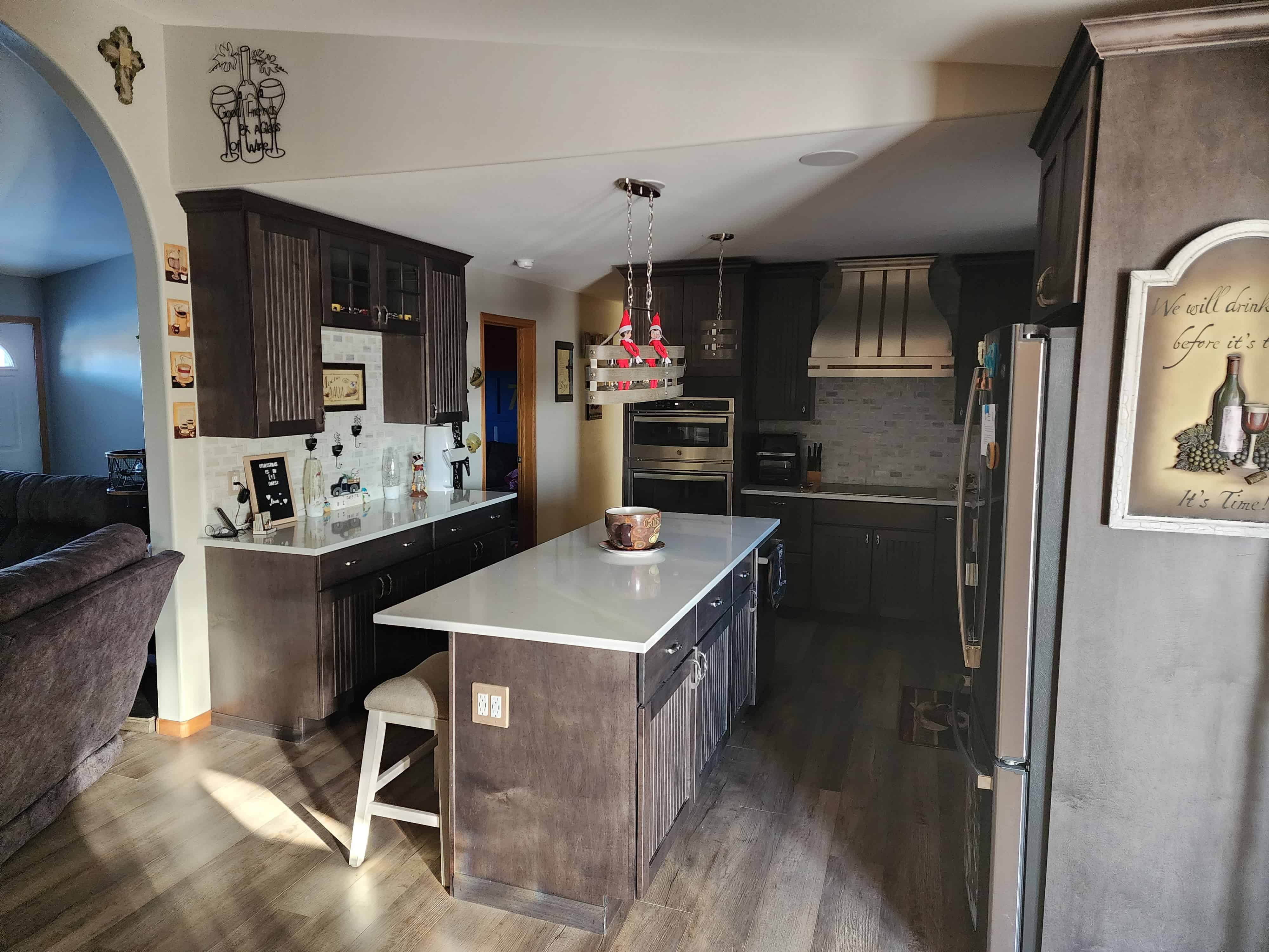 Embrace classic kitchen design idea with wood kitchen cabinets, white kitchen countertops, charming brick backsplash