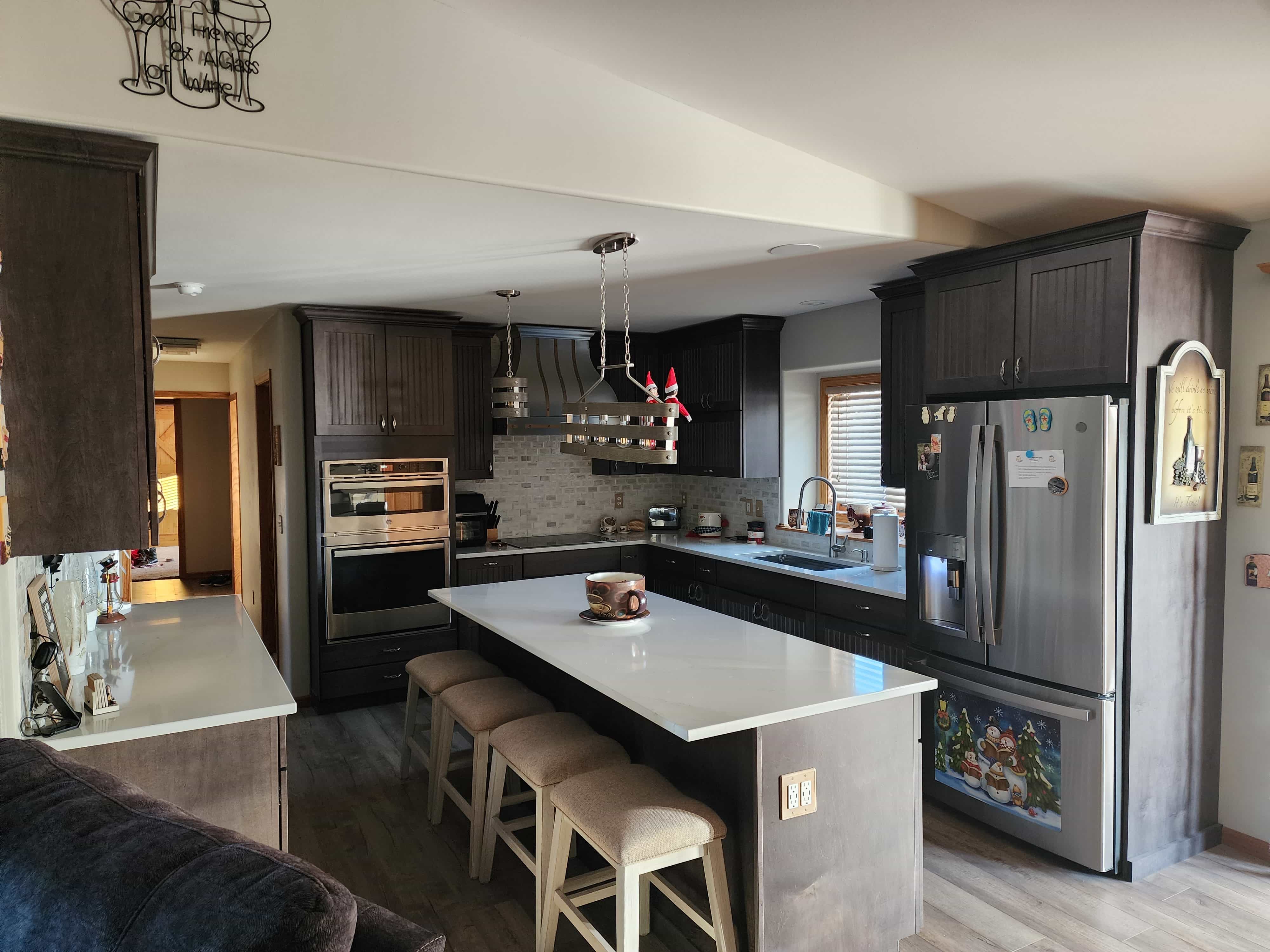 Stunning traditional kitchen design idea with wood kitchen cabinets, white kitchen countertops, captivating brick backsplash