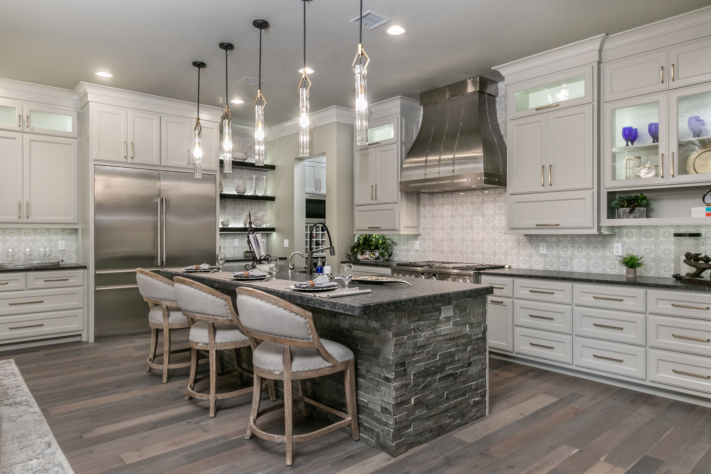 Classic kitchen planning,featuring elegant white kitchen cabinets that perfectly complement the luxurious marble kitchen countertops