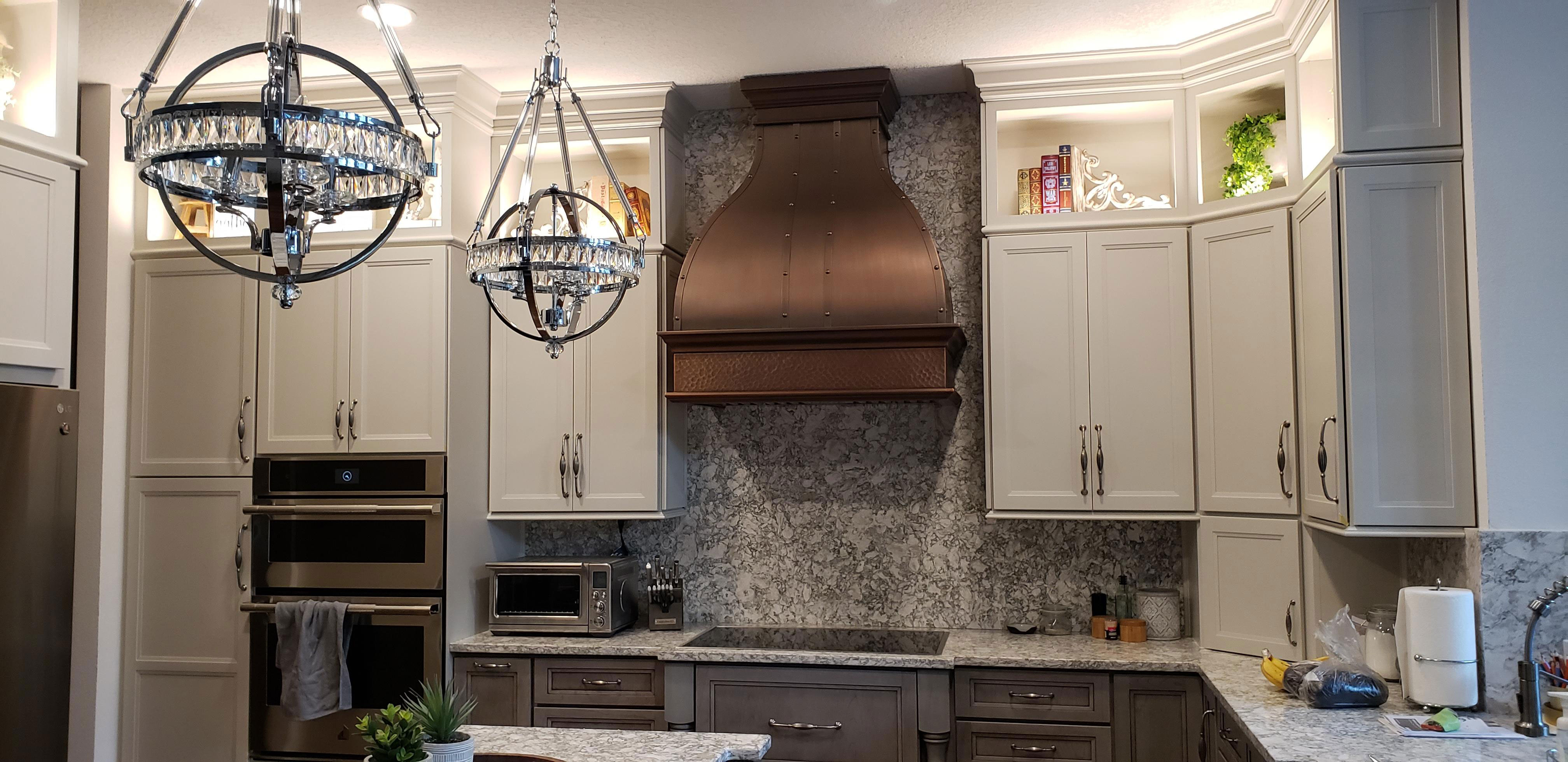 Copper hood attached to wall and ceiling with a round shape World CopperSmith