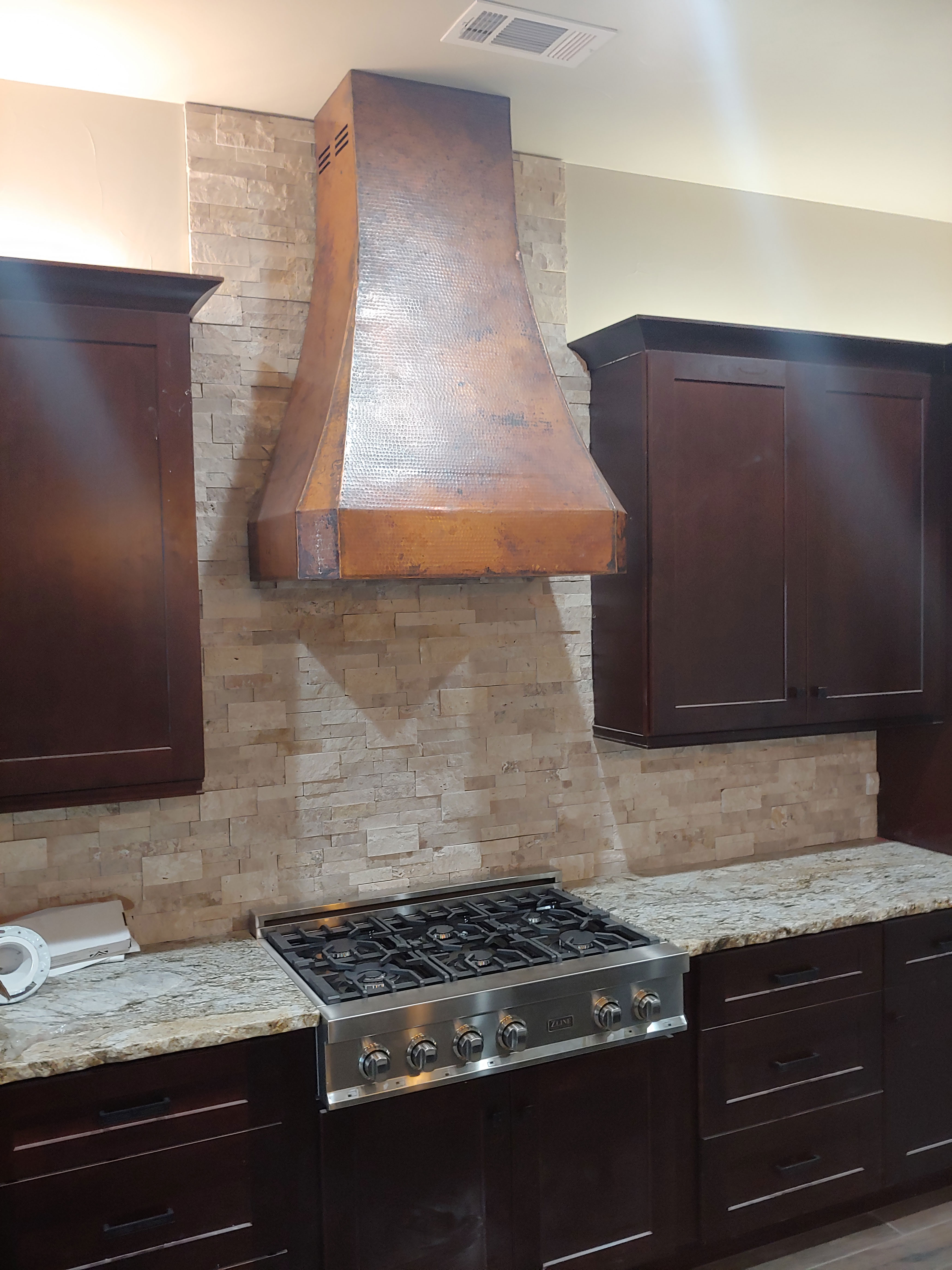 French kitchen design with range hood beautiful brown kitchen cabinet, white kitchen countertops charming brick backsplash