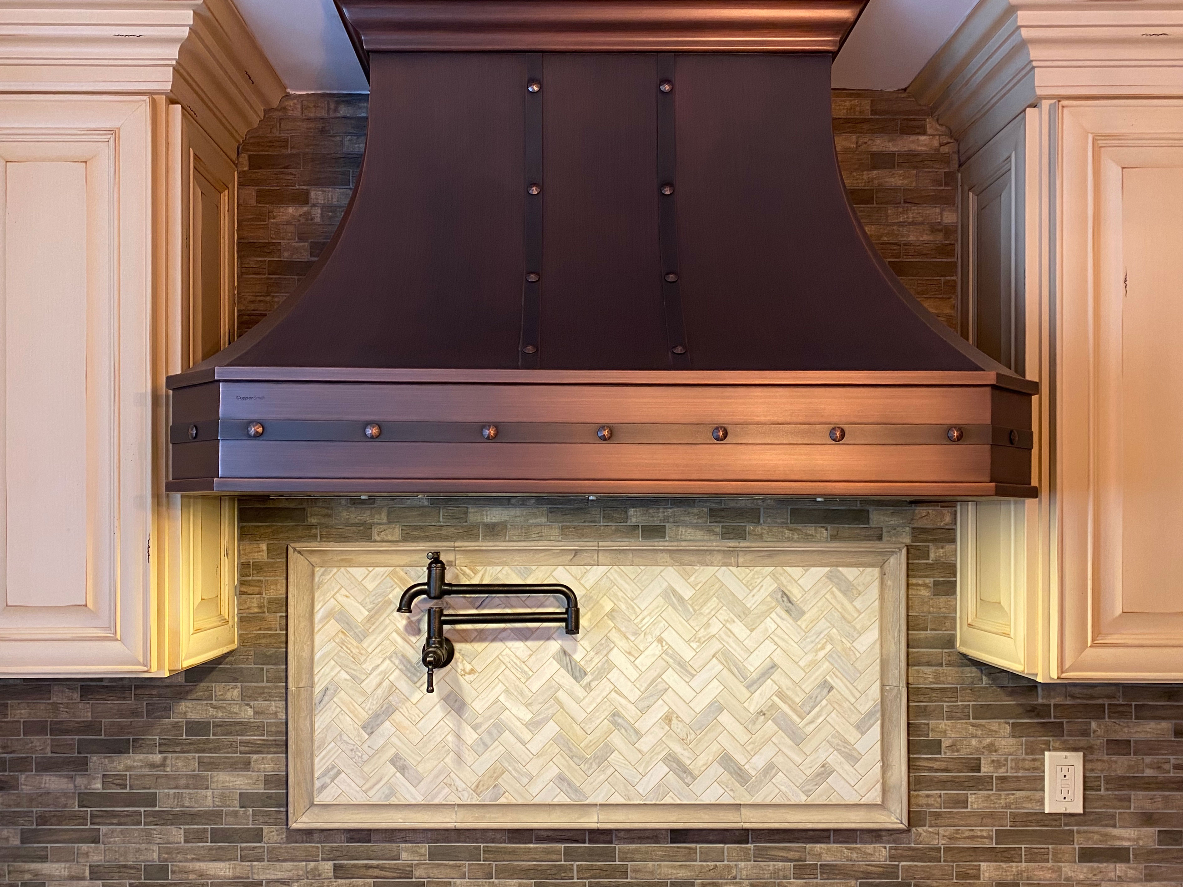 Amazing french kitchen design, featuring white cabinets captivating brick backsplash, while exploring range hood
