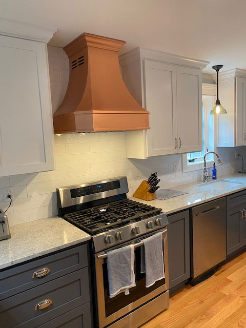 Muted copper range hood in modern minimalistic kitchen World CopperSmith