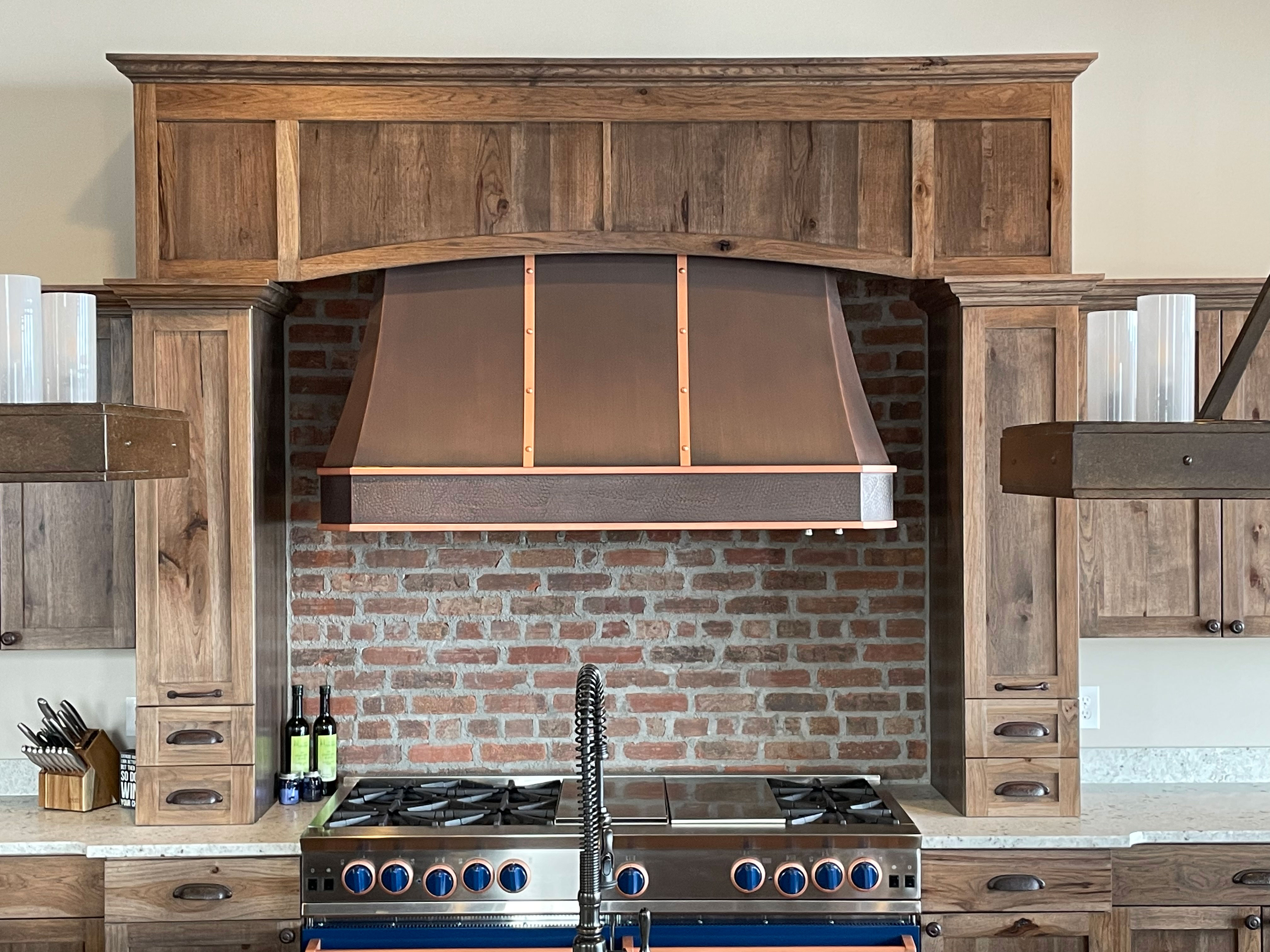A copper range hood with a vintage look and dual tone World CopperSmith