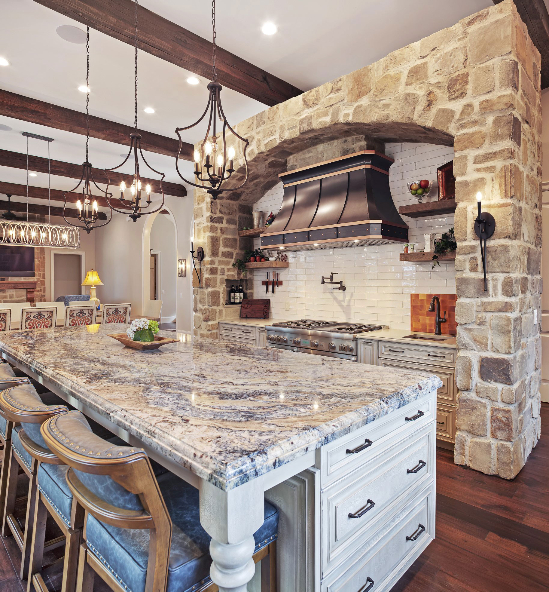 Charming cottage kitchen design with stylish range hood brown kitchen cabinets with marble kitchen countertops and brick backsplash