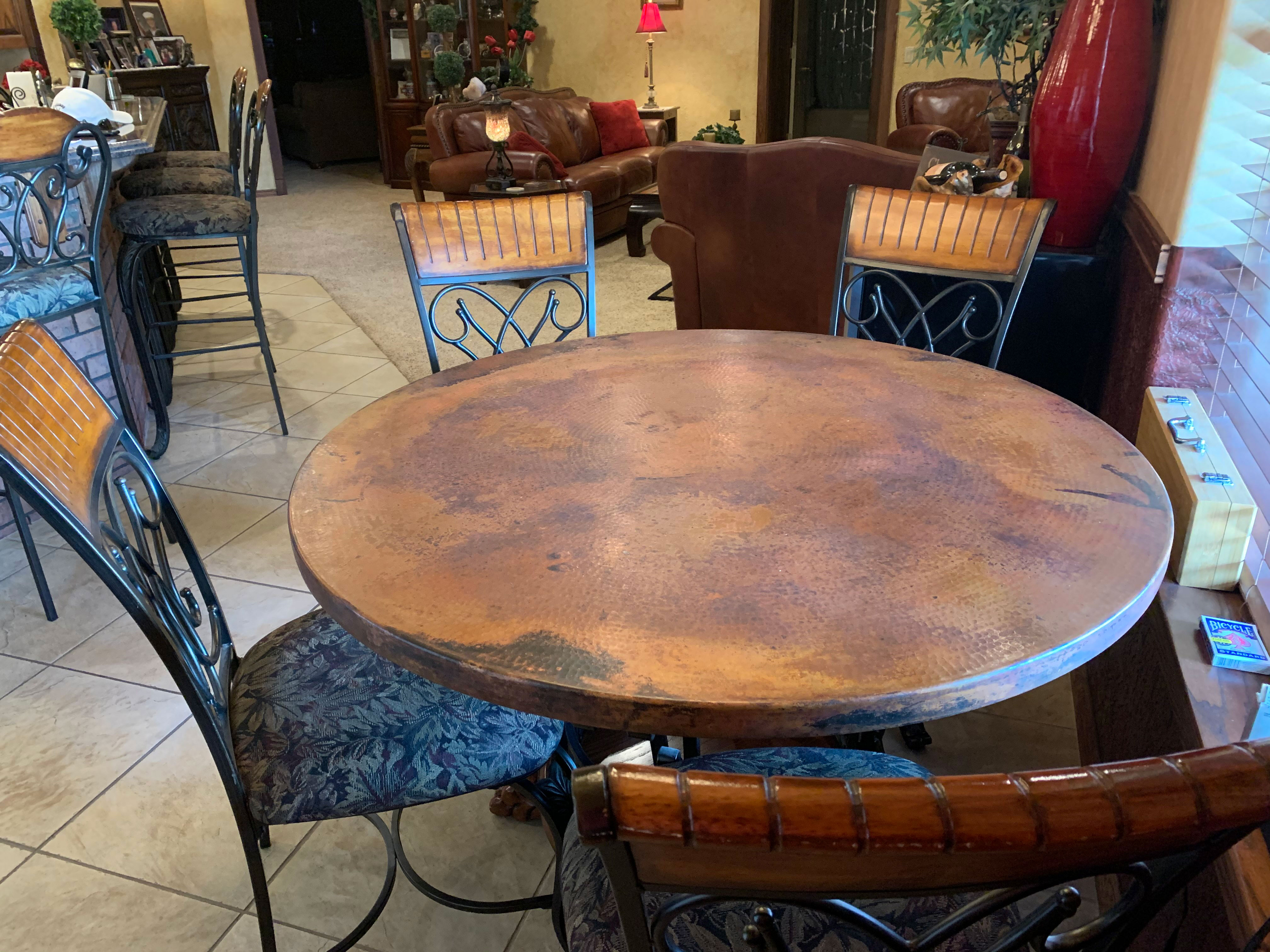 Round copper table with room for five people World CopperSmith
