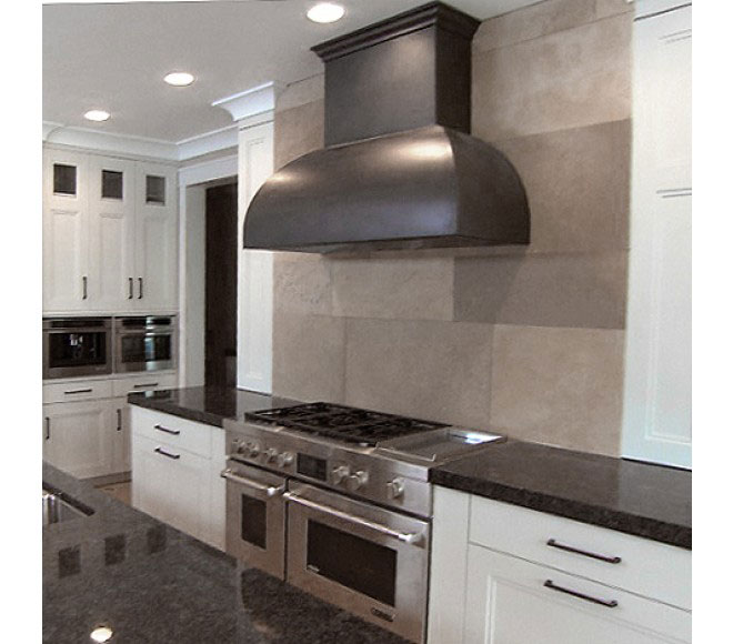 Beautiful kitchen design idea along with a range hood featuring white kitchen cabinets, marble kitchen countertops and brick backsplash