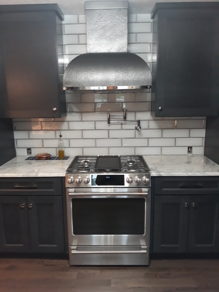 Inspiring kitchen design idea, including range hood options, french kitchen designs, black kitchen cabinets, pristine white kitchen countertops,brick backsplash