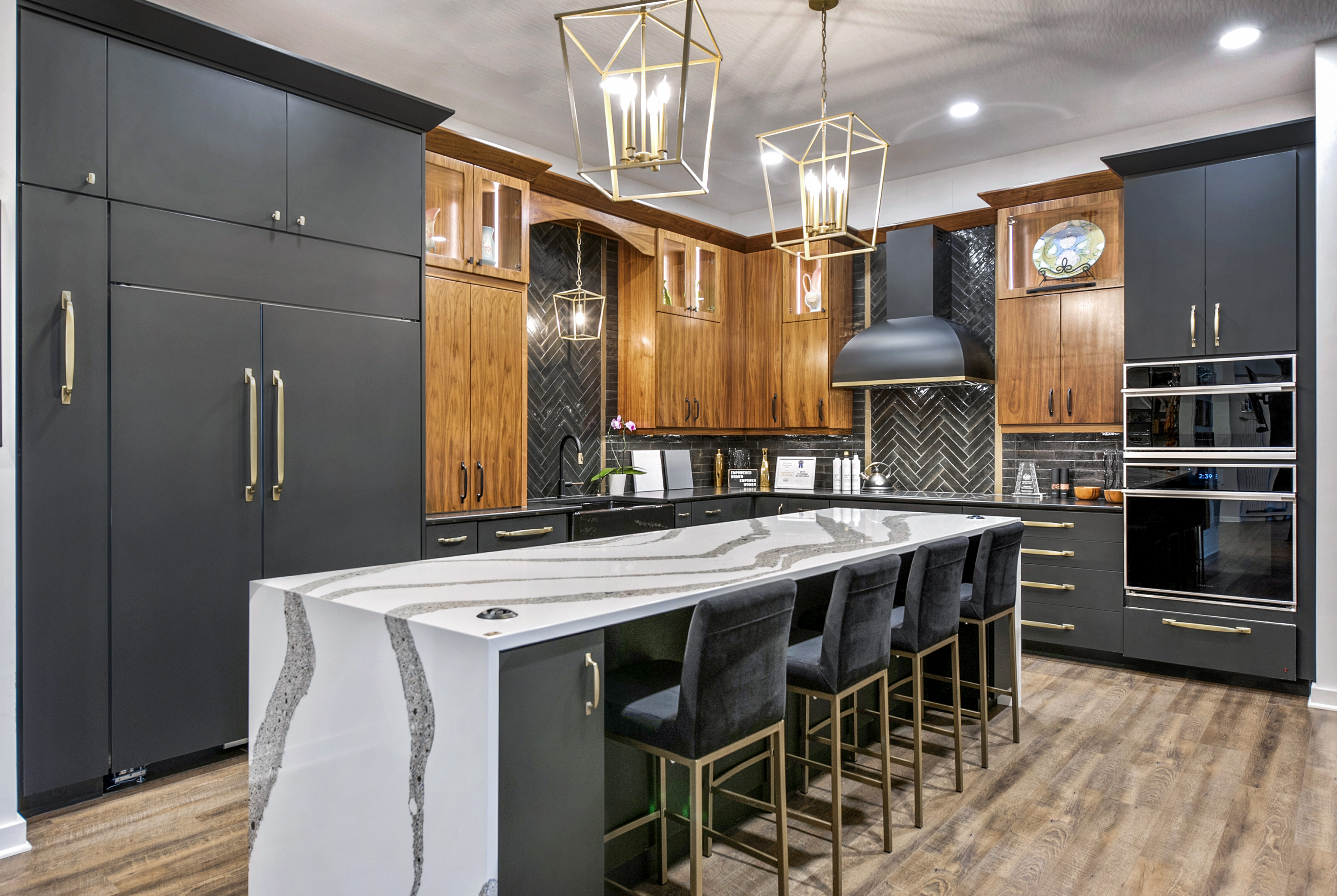 Classic kitchen design with grey kitchen cabinets and quartz kitchen countertops, incorporating a sleek range hood