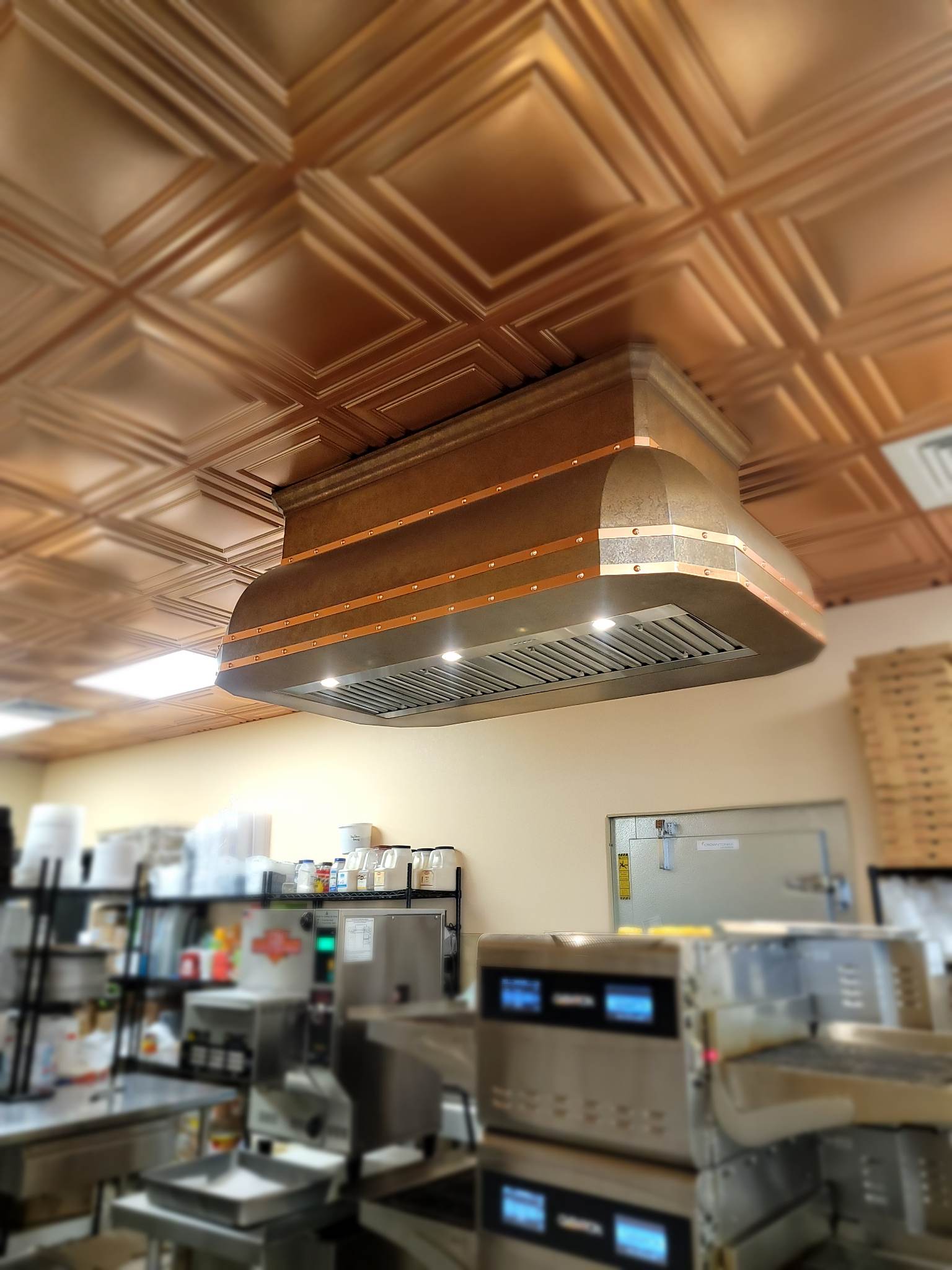 CopperSmith Euro ES9 Island Mount Weathered Copper Kitchen Range Hood with New Penny Copper Straps and Rivets industrial style in commercial food service