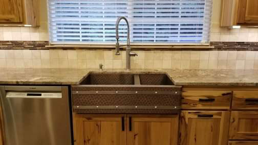Beautiful stylish kitchen design idea with kitchen sink idea featuring wood kitchen cabinets, marble kitchen countertops and brick backsplash