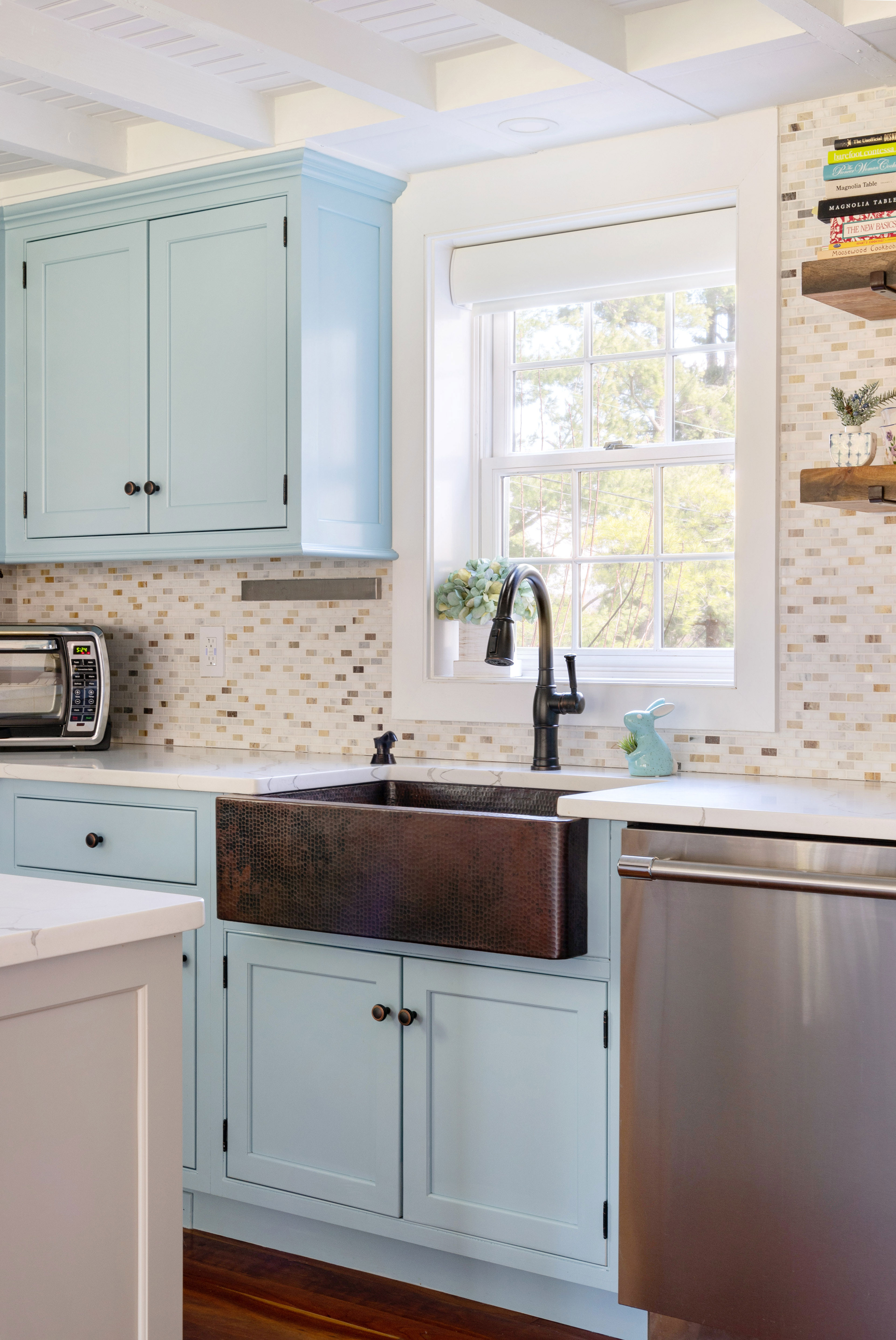 Classic kitchen design idea with sink idea featuring, white kitchen cabinets, marble kitchen countertops and brick backsplash