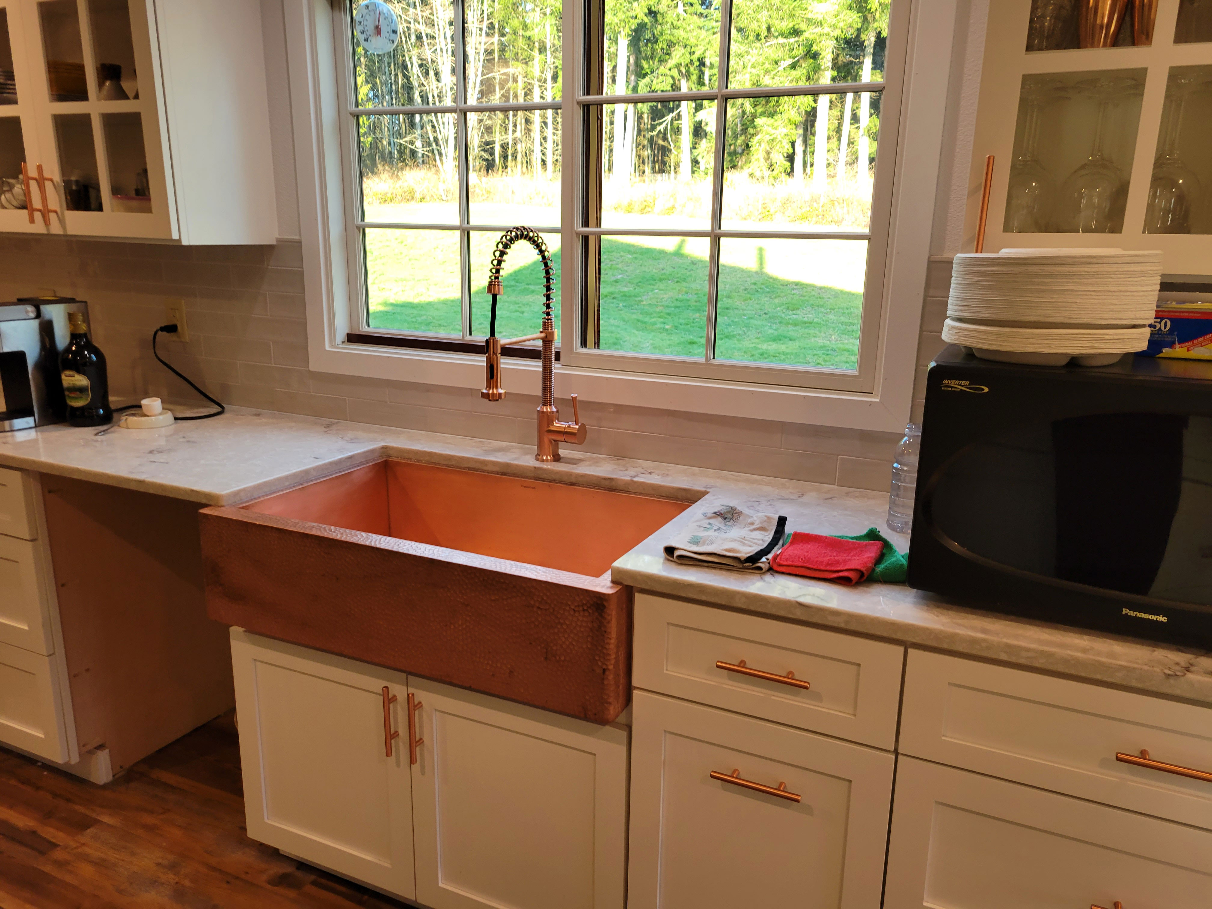 Beautifull kitchen design inspiring kitchen sink idea with white cabinets, marble countertops and rustic brick backsplash