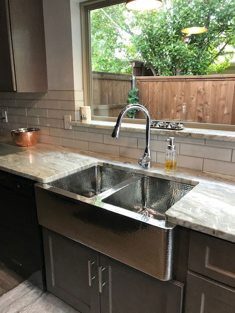 Stylish kitchen design idea with beautiful sink idea, grey kitchen cabinets, marble kitchen countertops and brick backsplash
