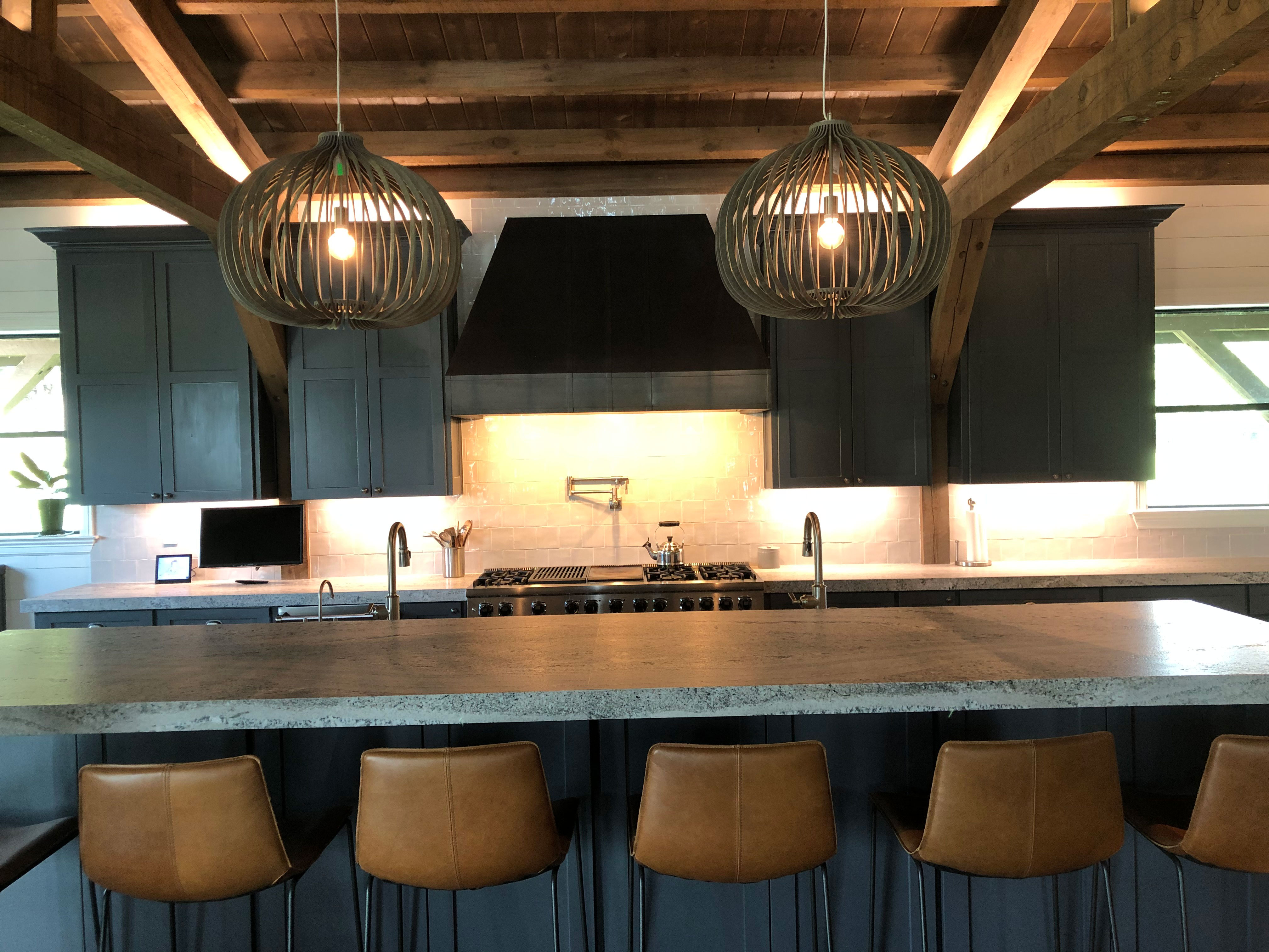 Contemporary kitchen with stylish kitchen table idea, grey kitchen cabinets, grey kitchen countertops and marble backsplash