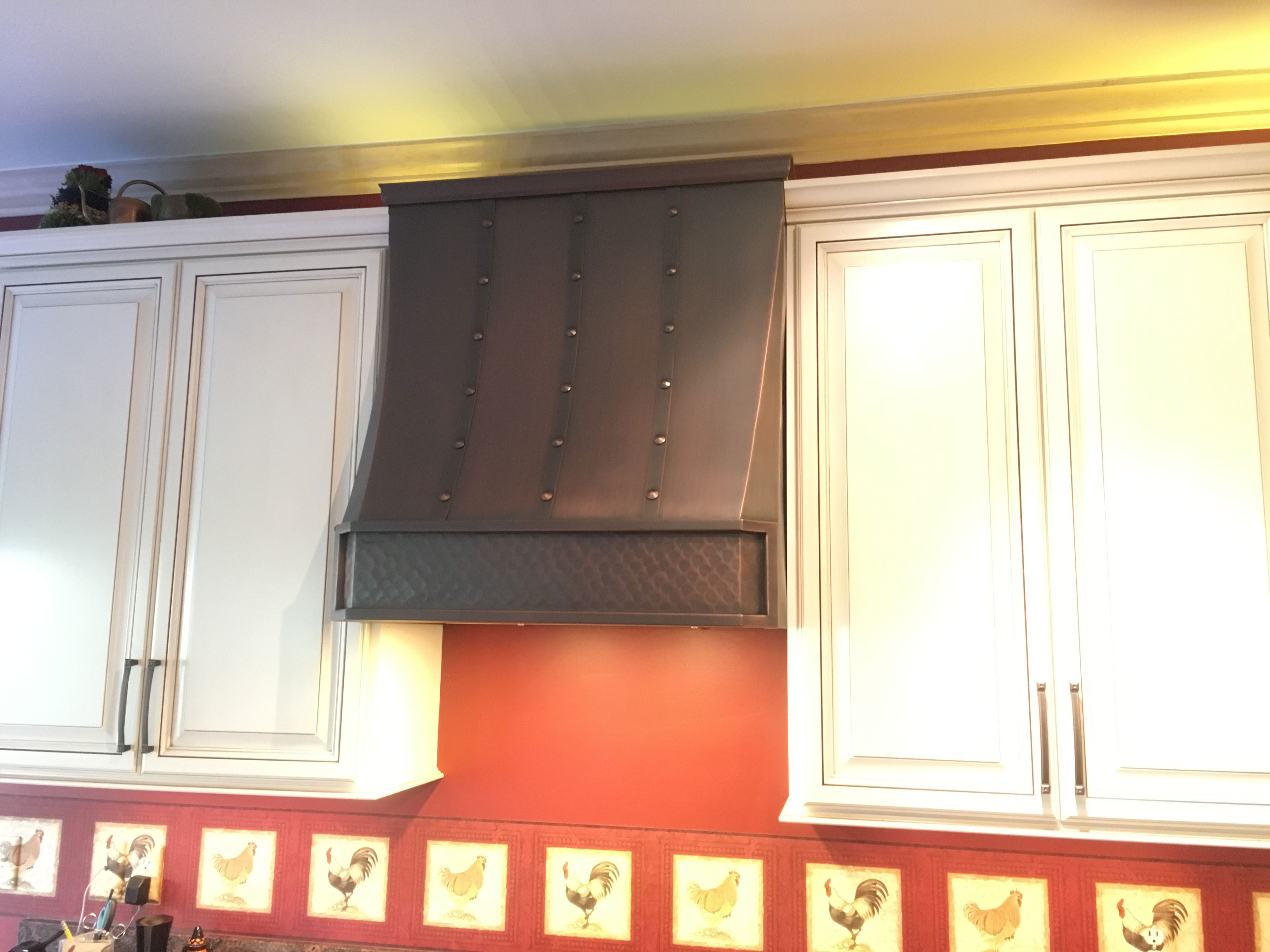 Discover inspiring kitchen design idea with range hood, featuring elegant white kitchen cabinets, esthetic appeal