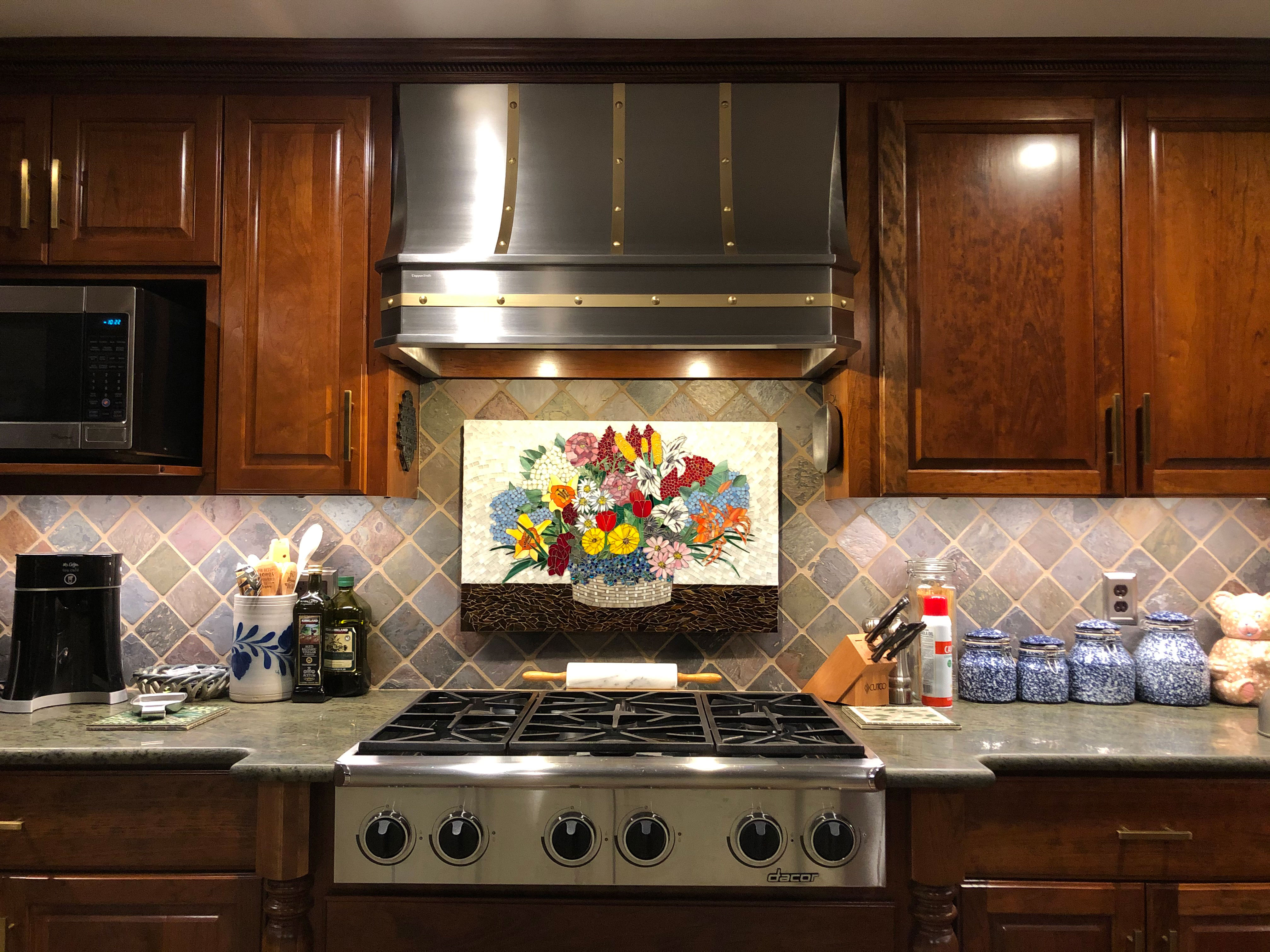 Charming country kitchen designs featuring range hood, kitchen cabinets, marble kitchen countertops, marble backsplash