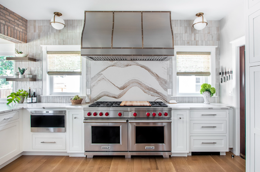 French kitchen design with range hood idea, white cabinets,marble countertops,marble backsplash