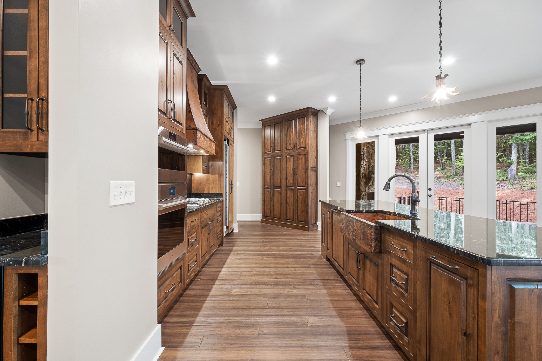 Open Kitchen with wood floors and copper sink World CopperSmith