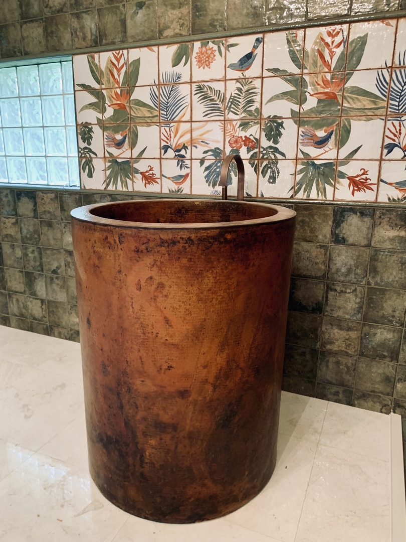A copper Japanese soaking tub with a hand-hammered texture World CopperSmith