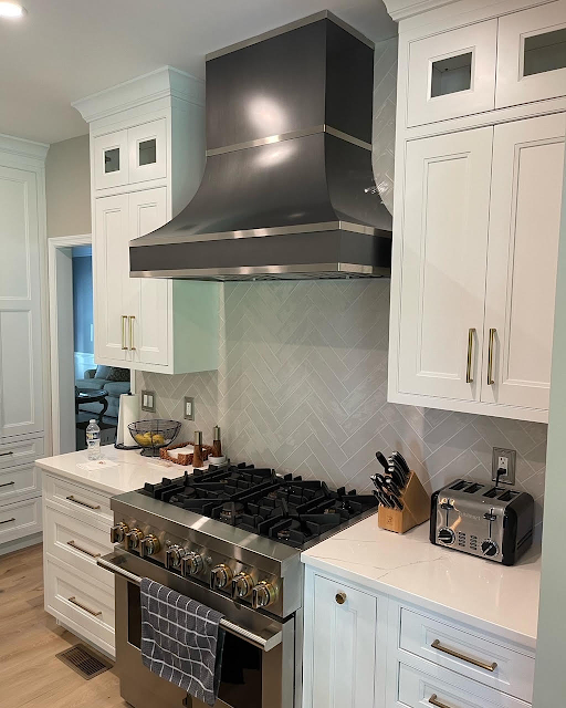Unique range hood kitchen design idea, french kitchen designs to white kitchen cabinets,white kitchen countertops, and luxurious marble backsplash