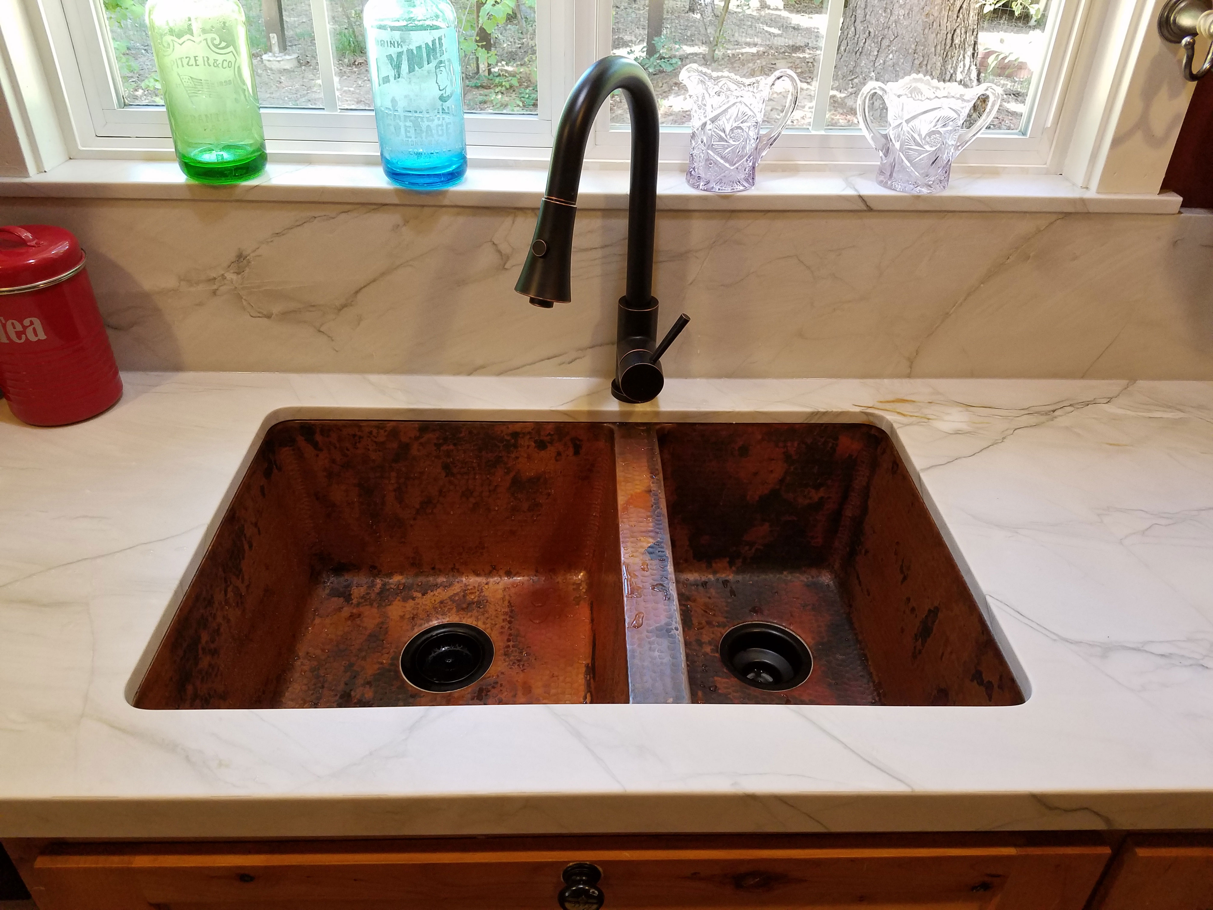 Undermount copper sink with natural black finish and windows World CopperSmith