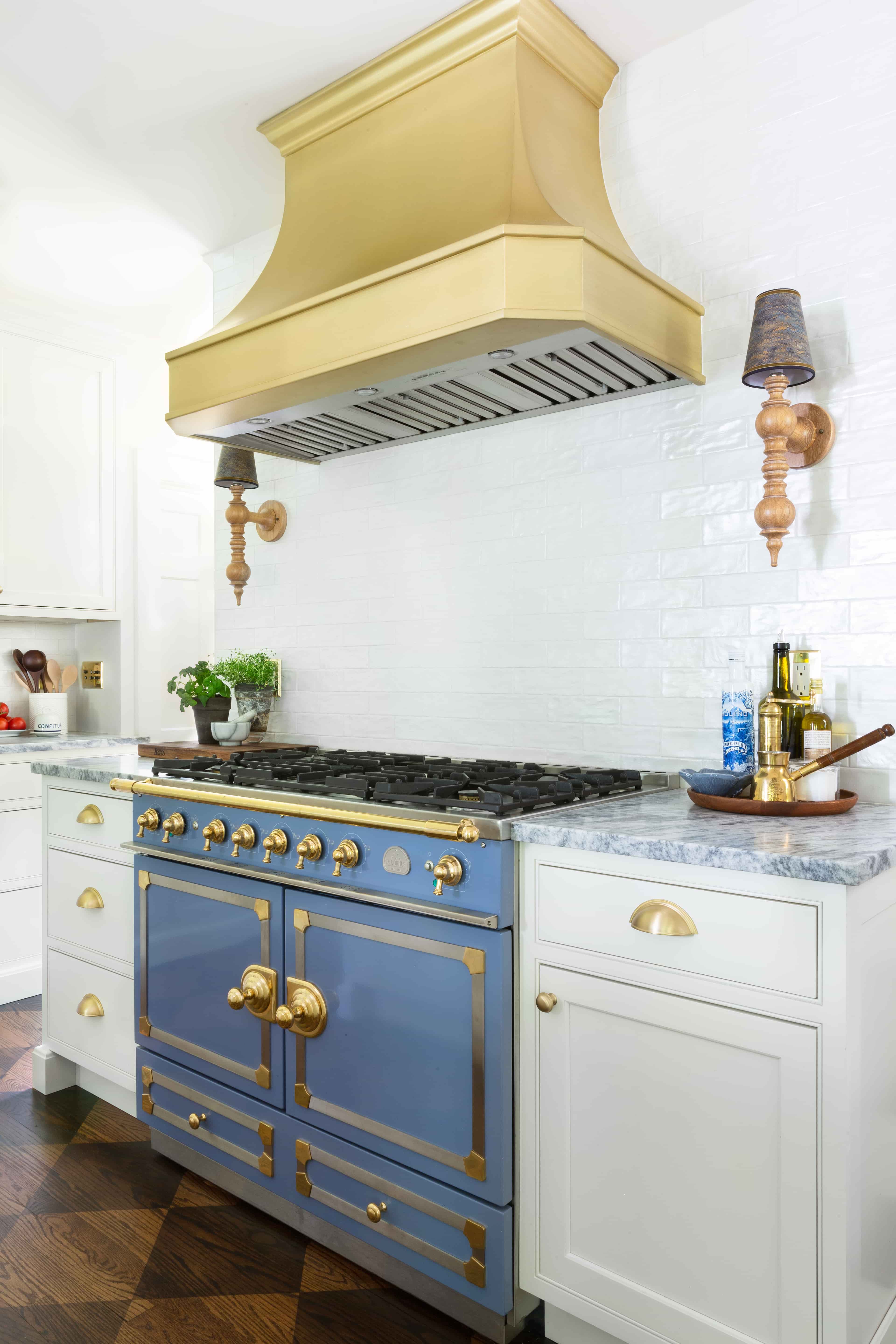 CopperSmith Classic CX4 Wall Mount Range Hood in a french style kitchen with Marble countertops white cabinets and white tile backsplash
